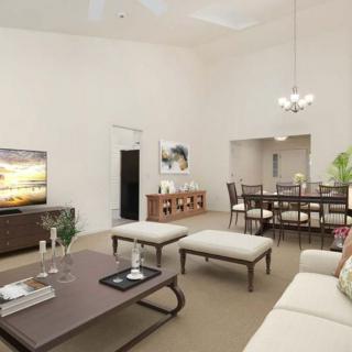 A modern living and dining area with elegant furniture and decor.