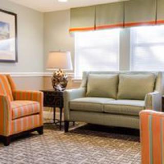 A cozy living room with comfortable seating and natural lighting.