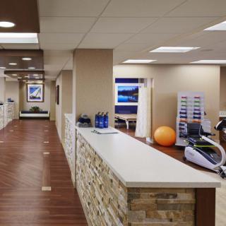 Modern fitness center with exercise equipment and a sleek interior design.