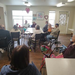 Residents engaging in a discussion at a community center.