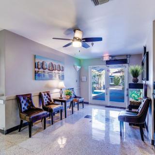 A modern lobby area with comfortable seating and bright lighting.