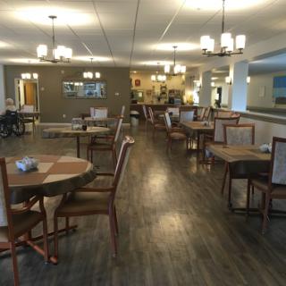 A spacious and modern dining area with elegant furnishings.