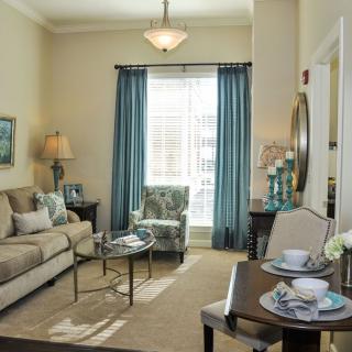 A cozy living room with elegant decor and comfortable seating.