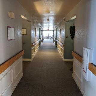 A quiet and empty hallway with soft lighting in a building.