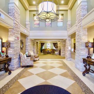 A spacious and elegantly designed lobby area with comfortable seating and sophisticated lighting.