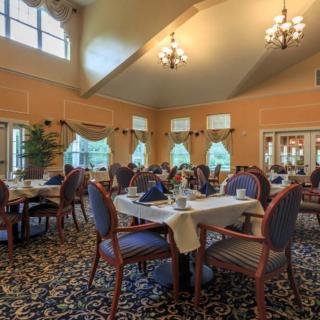 Elegant dining room with neatly arranged tables and classic decor.