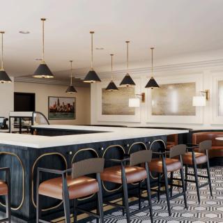 A modern bar interior with stylish seating and pendant lighting.