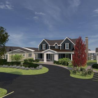 A suburban house with a curved driveway and well-maintained landscaping.
