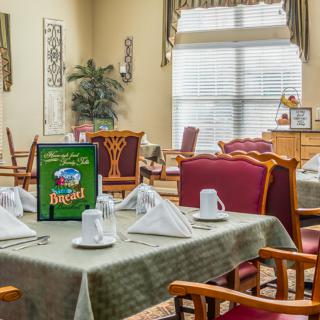 An inviting dining area with neatly set tables and comfortable seating.