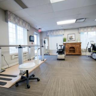A well-equipped rehabilitation and therapy room with exercise equipment.