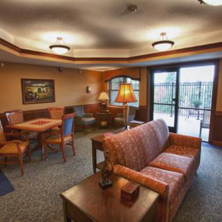 A cozy living room with comfortable seating and warm lighting.