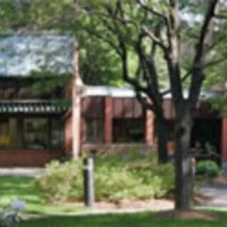 A building surrounded by trees and greenery.