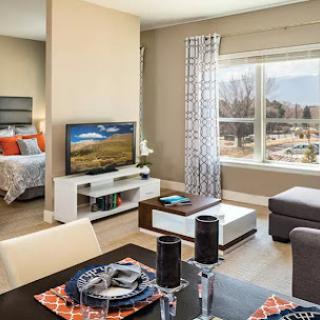 A cozy and modern living space featuring a combined dining and living area with bright natural light.