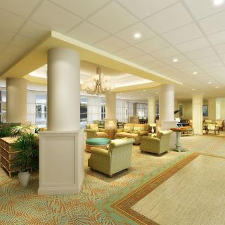 A spacious and elegantly designed lobby with comfortable seating and ambient lighting.