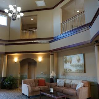 A spacious and elegantly designed lobby with comfortable seating and warm lighting.