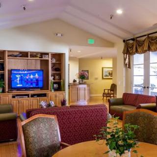 A cozy living room with comfortable seating and a television.