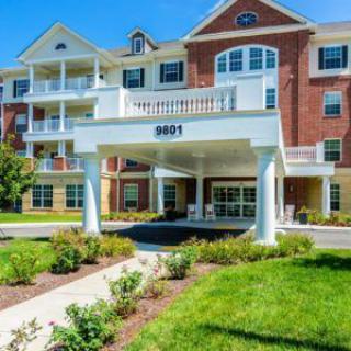 A modern residential building with a welcoming entrance and well-maintained landscaping.