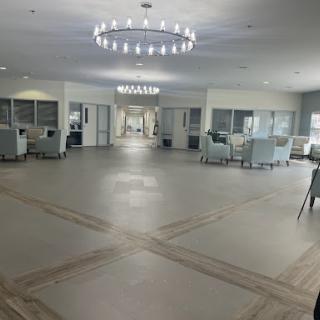 A spacious and modern lobby with elegant lighting and comfortable seating areas.