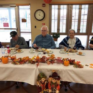 Seniors enjoying a festive Thanksgiving meal together.