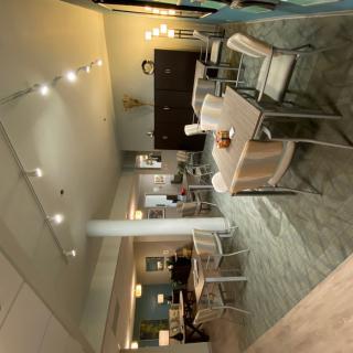 A modern dining area with stylish furniture and warm lighting.