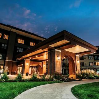 Illuminated building entrance at night.