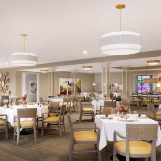 A modern dining area with elegantly arranged tables and soft lighting.