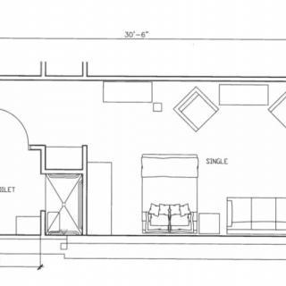 A detailed floor plan of a room showcasing furniture arrangement and dimensions.