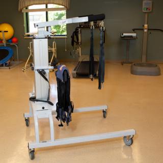 A piece of rehabilitation equipment designed to assist with physical therapy and mobility training.