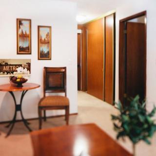 Cozy interior hallway with wooden furniture and decorative artwork on the walls.