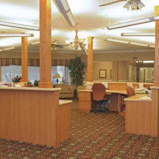 A spacious office interior with desks and computers.