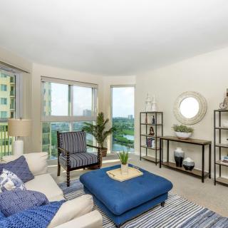 A bright and modern living room with stylish furnishings and ample natural light.