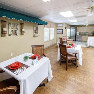 A cozy dining area with elegantly set tables and stylish decor.