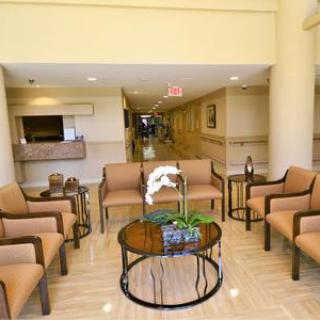 A welcoming lobby area featuring comfortable seating and a decorative table.