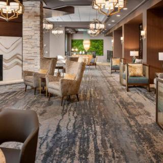 A modern and luxurious hotel lobby with elegant seating arrangements.