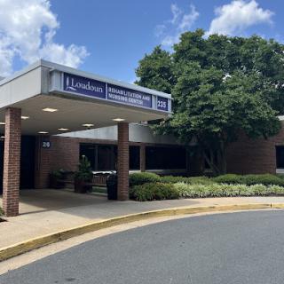The entrance of a healthcare facility on a bright sunny day.