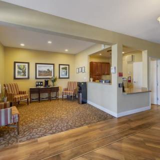A cozy lobby area with comfortable seating and a reception desk.
