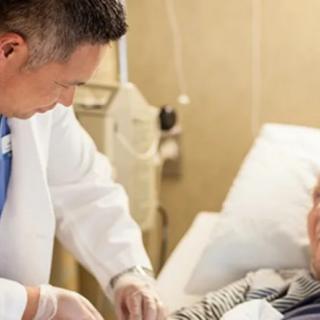 A doctor attending to a patient in a hospital setting.