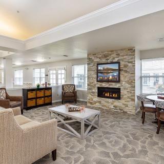 A cozy modern living room with a fireplace and stylish furniture.