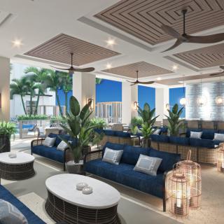 Modern lounge area with comfortable seating and lush greenery.