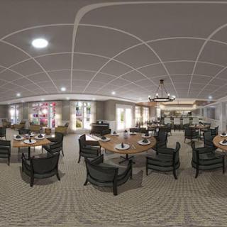A spacious and elegantly designed dining area with modern furniture, perfect for gatherings or intimate meals.