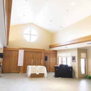 Bright and serene church interior with an altar and wooden accents.