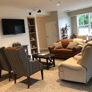 A cozy living room with comfortable seating and a television.