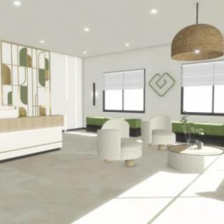 A modern and minimalist waiting room with stylish furniture and ample natural lighting.