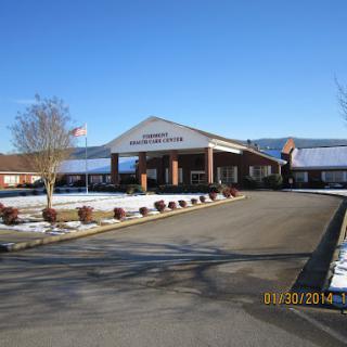 A picturesque view of a facility surrounded by snow on a clear day.