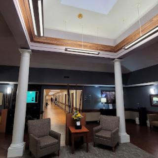 A modern lobby area featuring comfortable seating and stylish design elements.