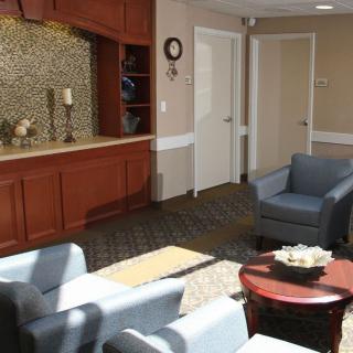 A cozy waiting room with comfortable seating and decorative elements.