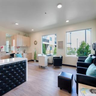 A modern and inviting reception area with comfortable seating and natural lighting.