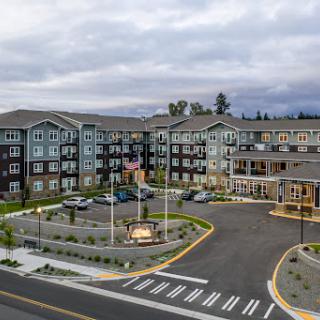 A modern hotel complex featuring landscaped grounds and a welcoming entrance.