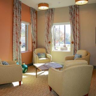 A cozy living room with comfortable seating and natural light.