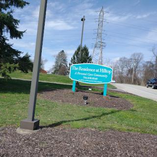 Entrance sign at a park showcasing a scenic outdoor environment.